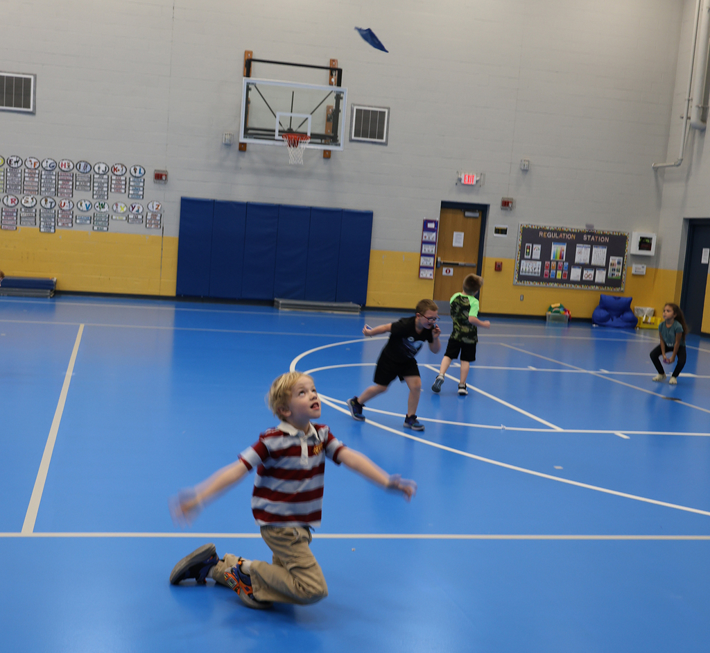 Student tossing and catching bags