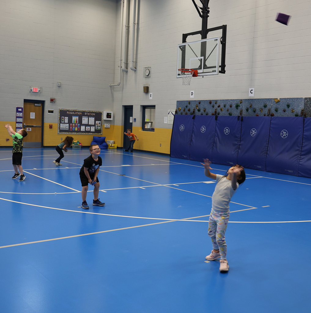 Student tossing and catching bags