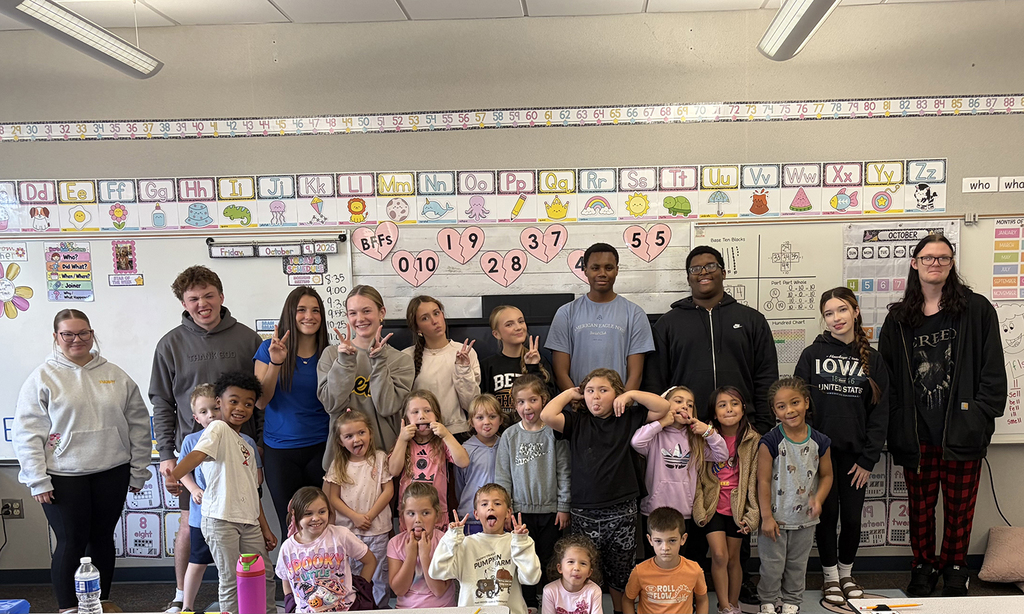 The group of HS and NA students pose for a picture.