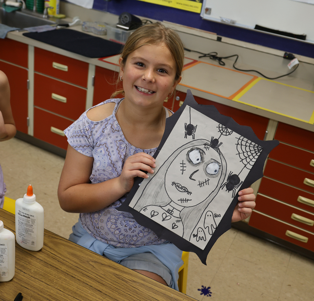 A girl with her portrait spiders and ghosts