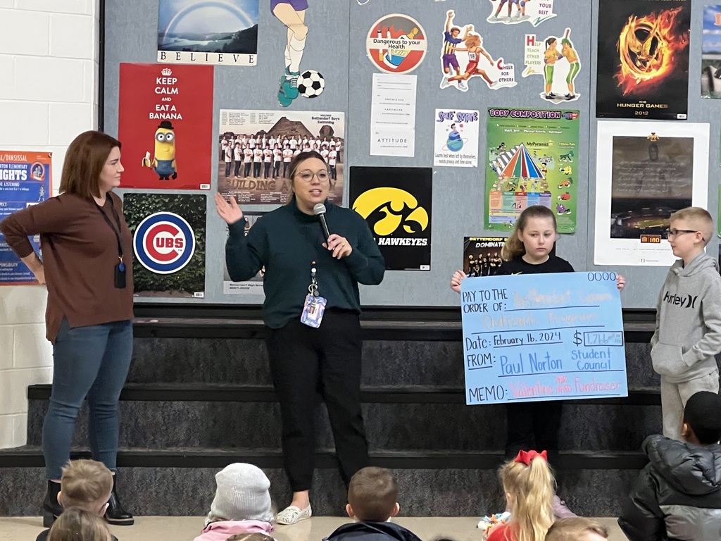 Student council presenting their check to Bett Outreach