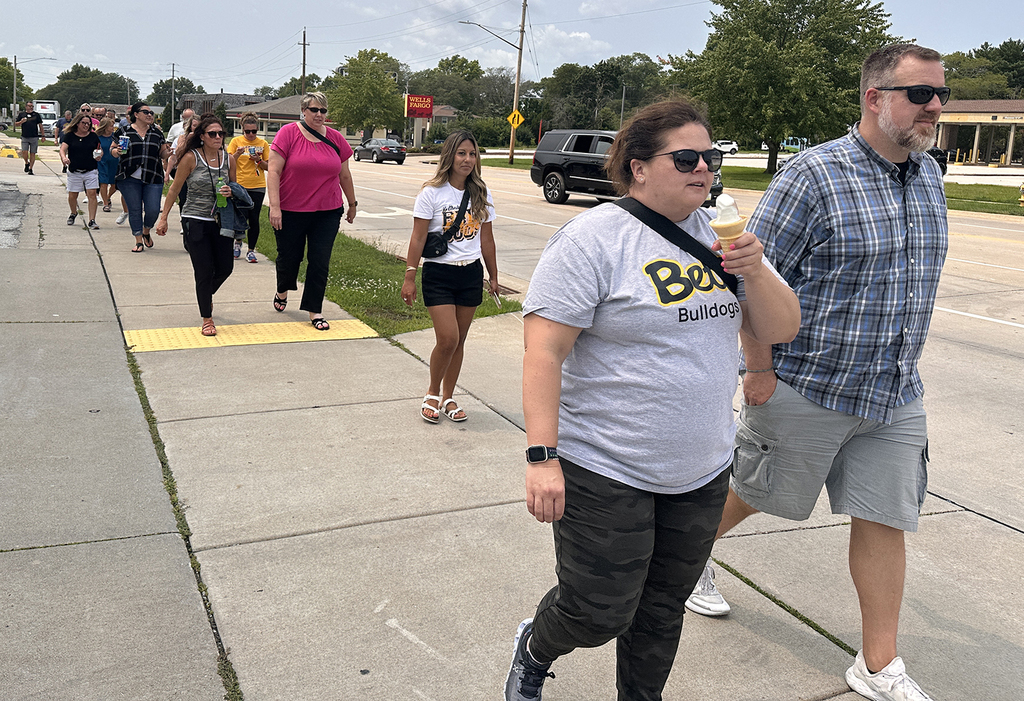 Administratiors walking back from Dairy Queen