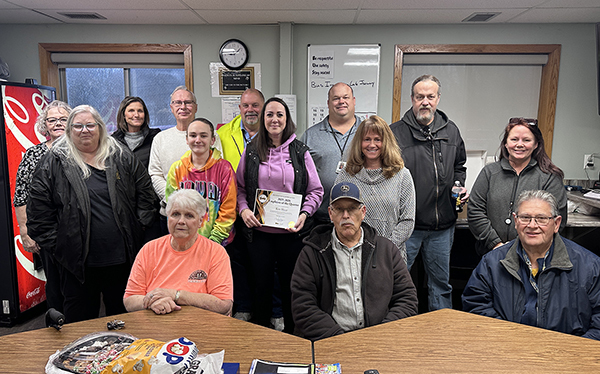 Kim Haut with Dr. Morse with the operations staff and a few former operations employees