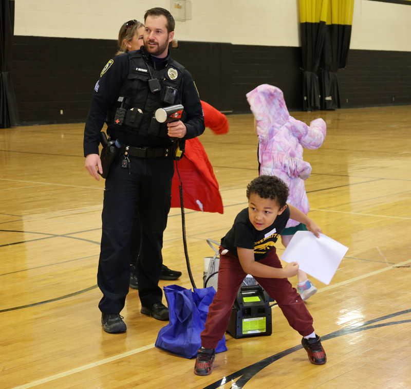 Bettendorf police measuring the speed of a kid's baseball 