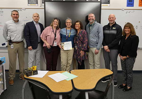 Teresa Heden-Detlefsen with Dr. Michelle Morse and the high school administrative team: Kevin Skillett, Anthony Wittemeyer, Kristy Cleppe, Jennifer Wikan, Conrad Keilbler, and Zach Shay
