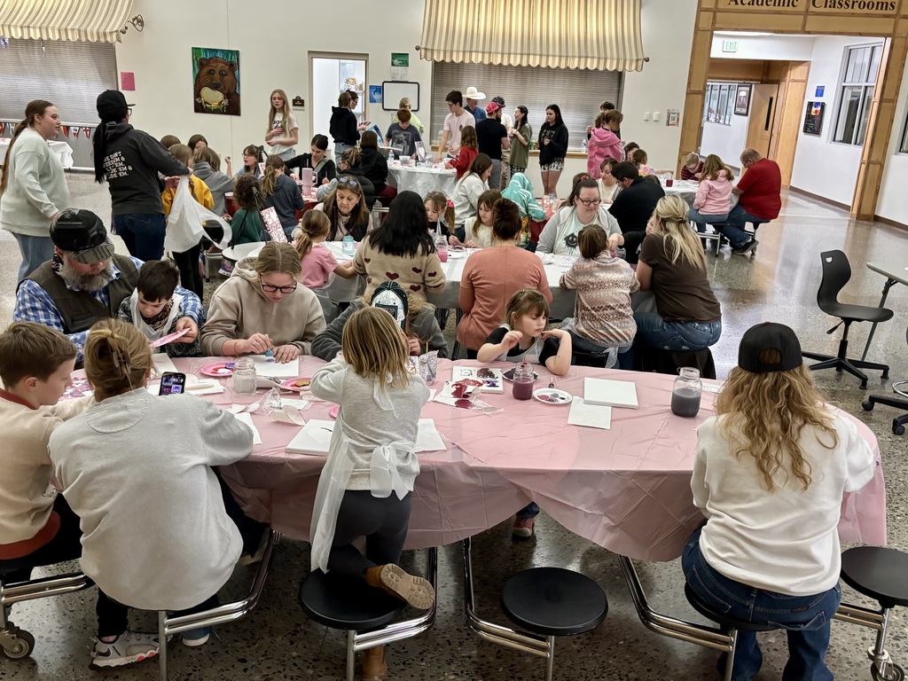 Full house of artists painting at the event