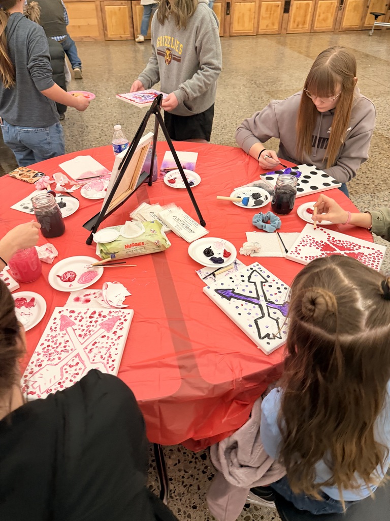 Students participating in one of the valentine themed paintings