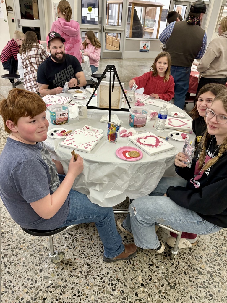 Elementary and middle school students painting