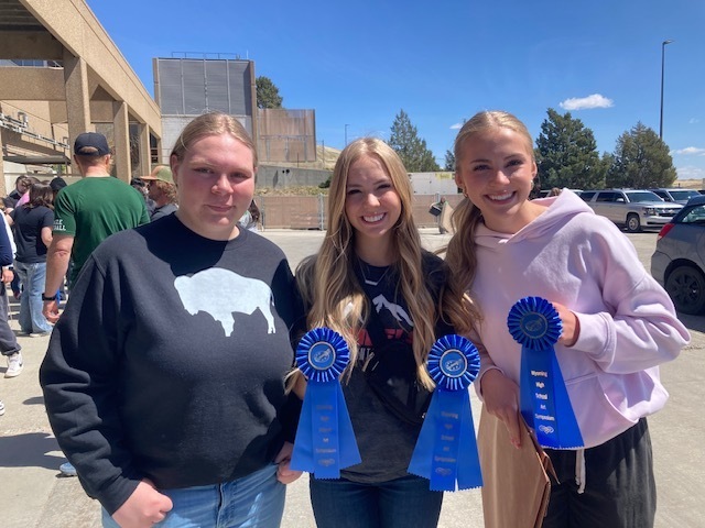 Lilian Wenstrom, Taylor and Gifford posing with their accomplished ribbons.