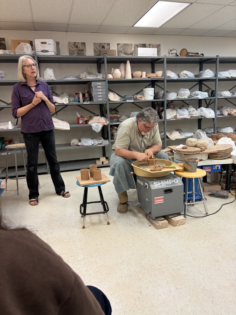 John Moore and Elaine DeBuhr demonstrating the pottery wheel
