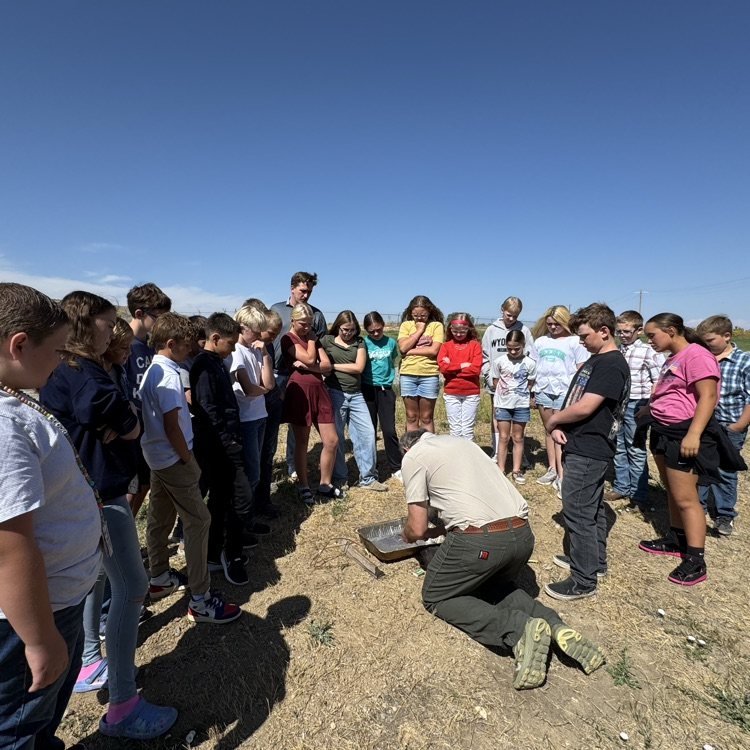 Learning how to safely start a fire in the wilderness.