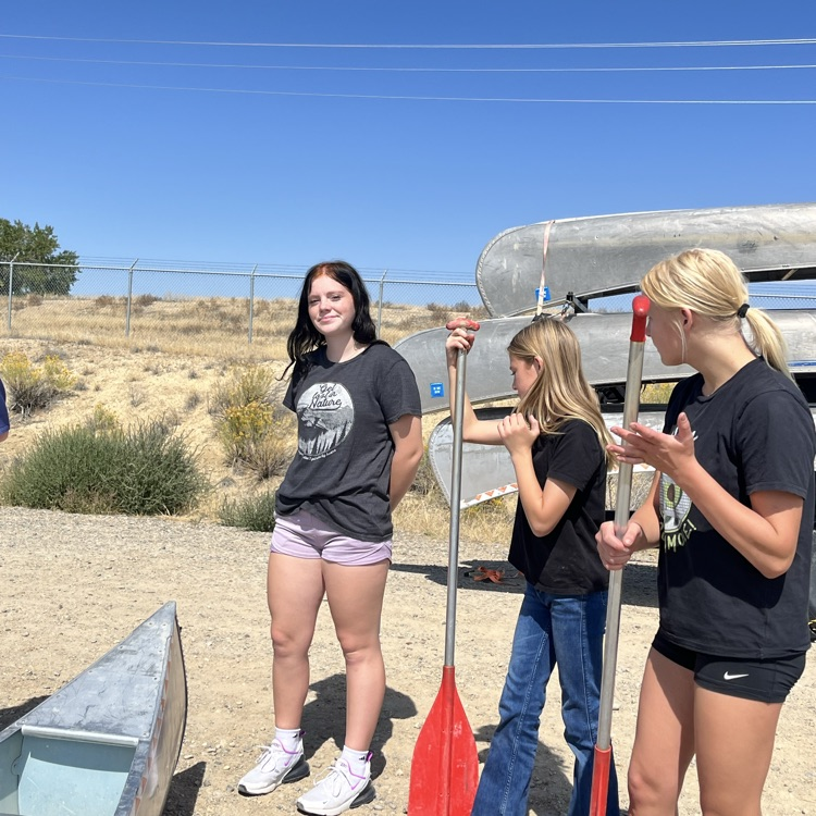 girls listening about proper way to get into canoe