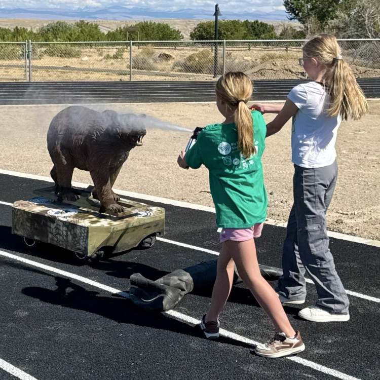 The kids practicing bear spray with Robo Bear!