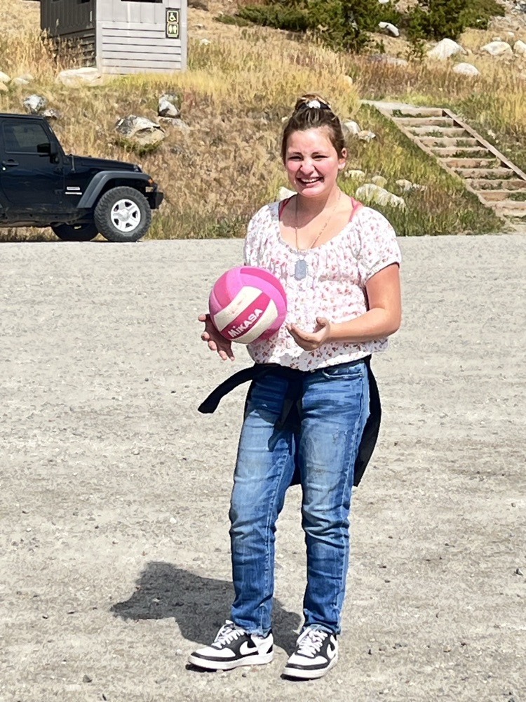 Enjoying volleyball at the lake