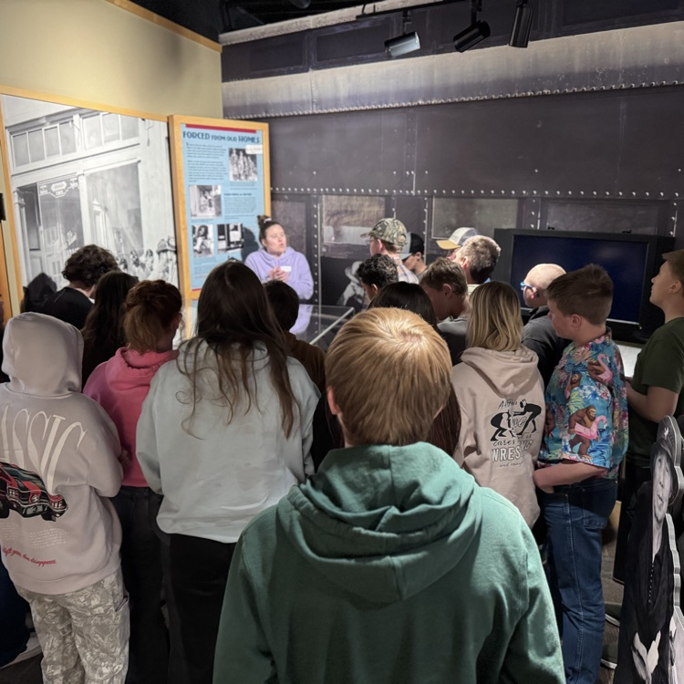 The tour guide showing them how people had to leave their homes.  