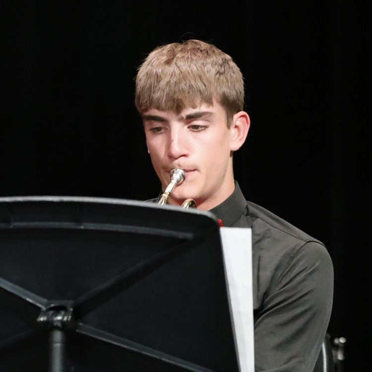 Kenneth playing with the band  