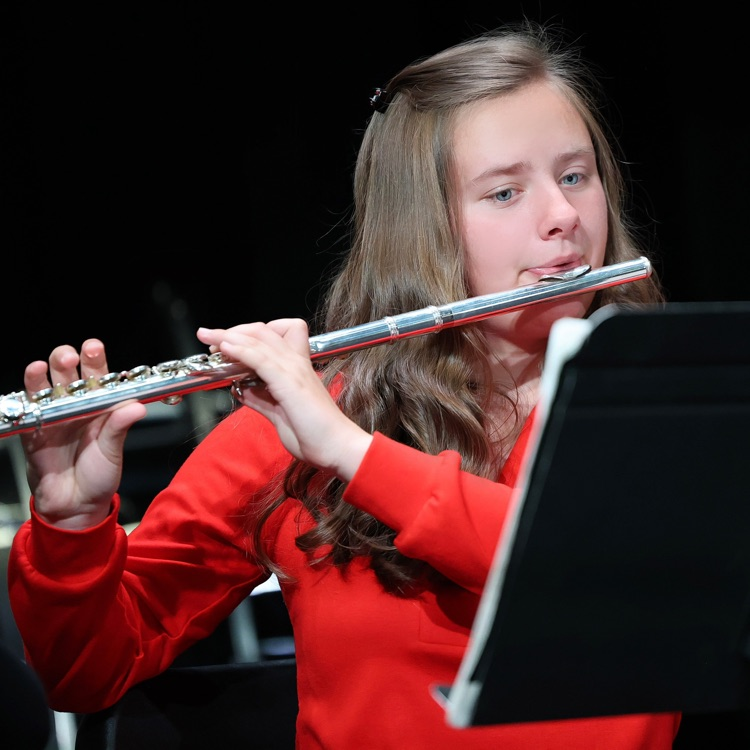 Kelsey playing her flute  
