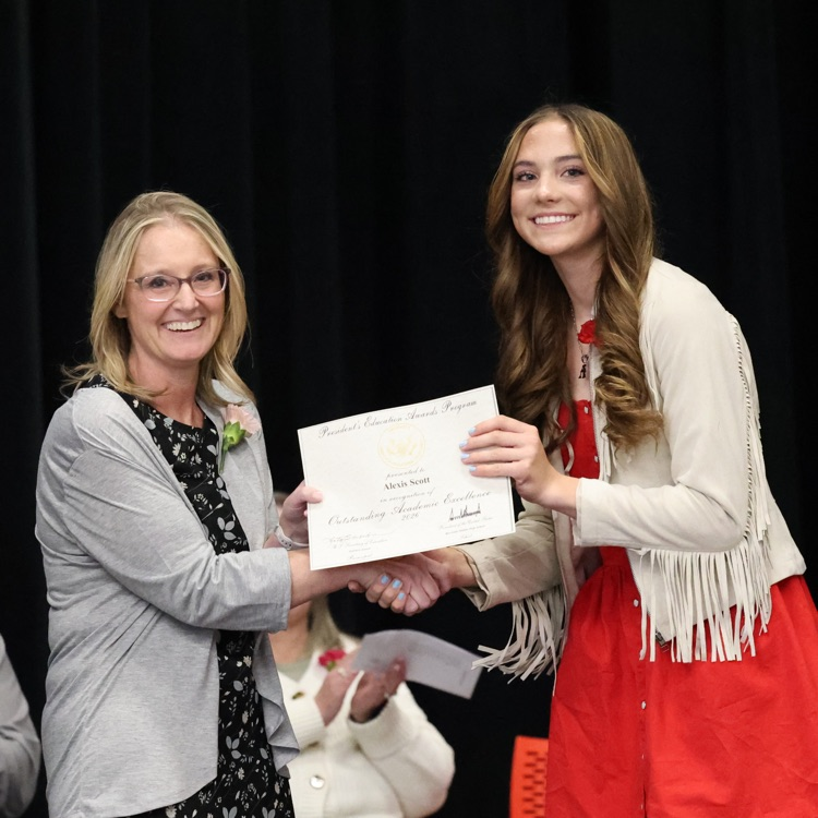 Alexis receiving a special academic award.  