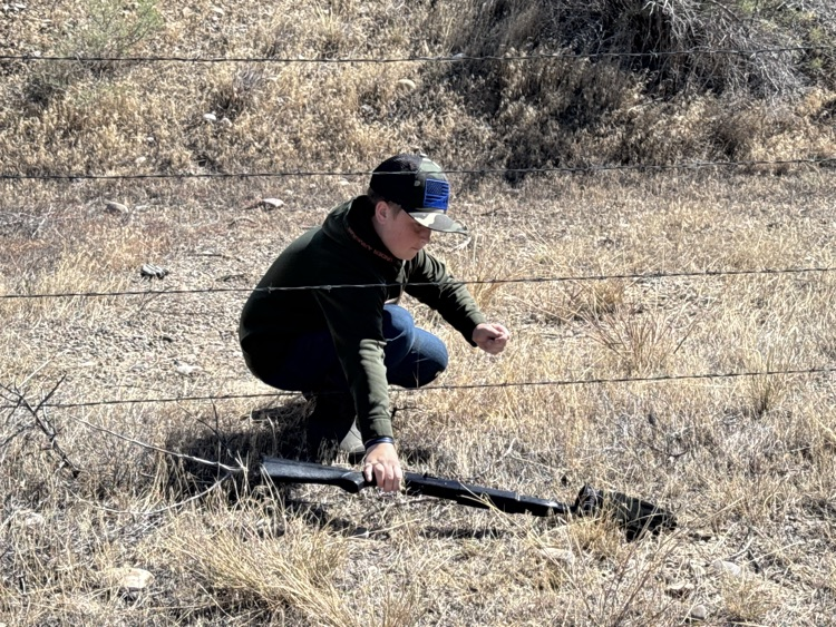 Safe gun handling while crossing a fence.  