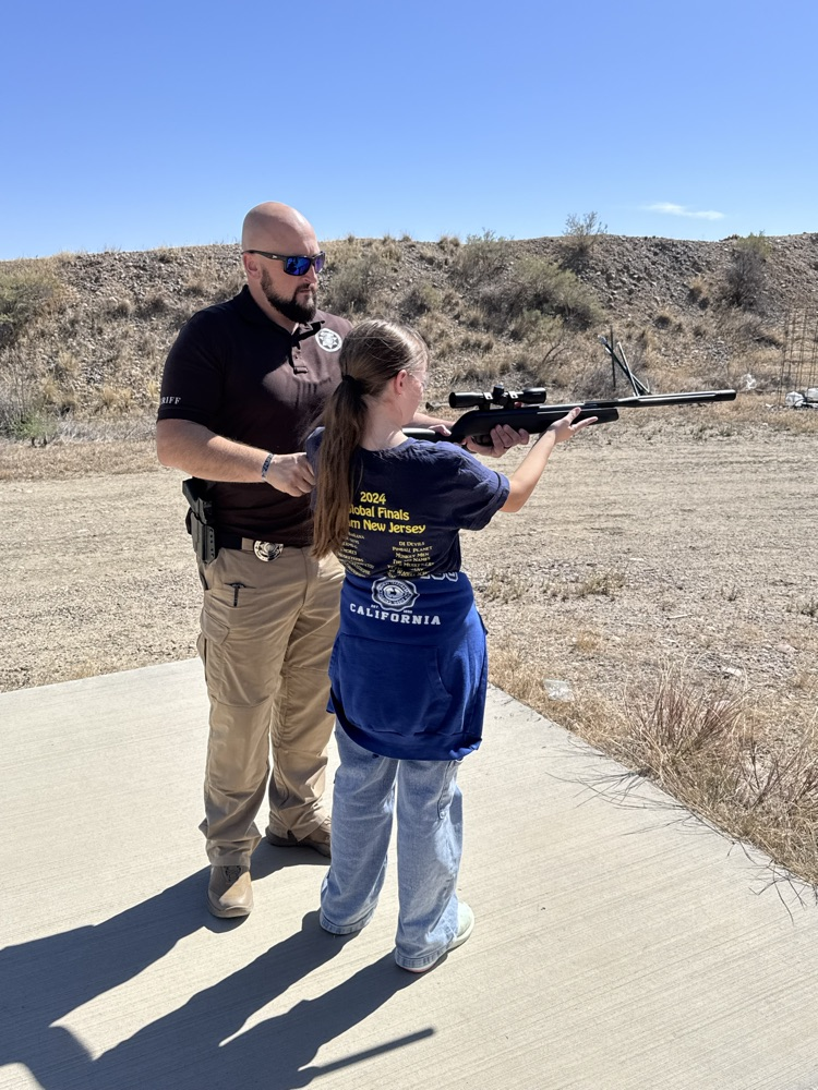 Big Horn County Sheriff Deputy helping out student  