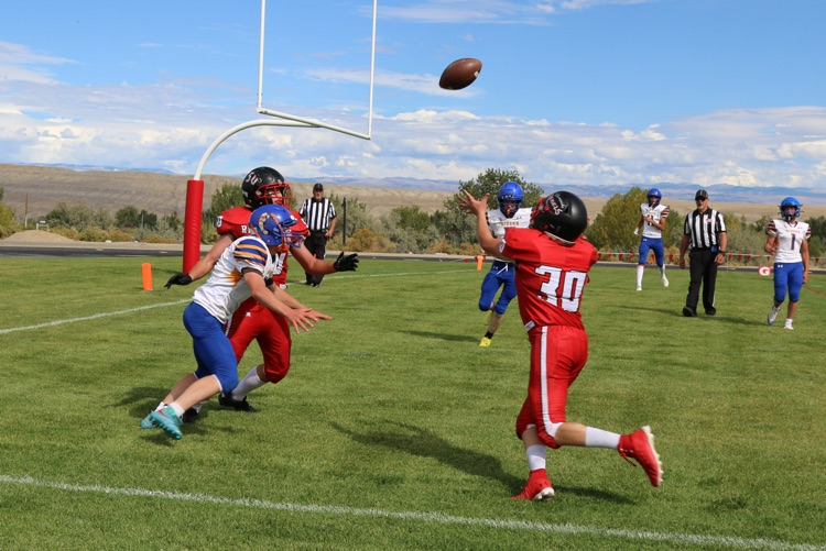 The deflected pass is still successfully caught by Dawson Scott.