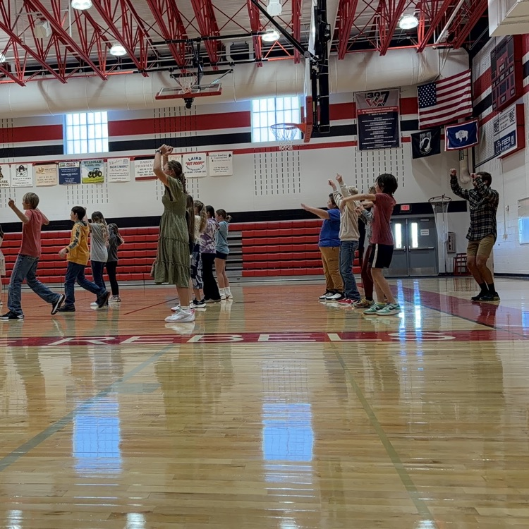 Mr. Brown line dancing with his students 