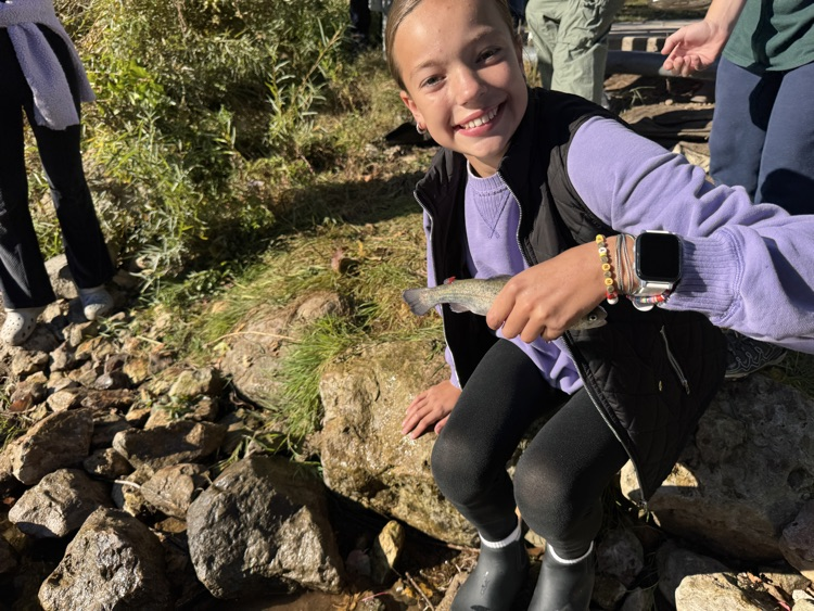 student with trout