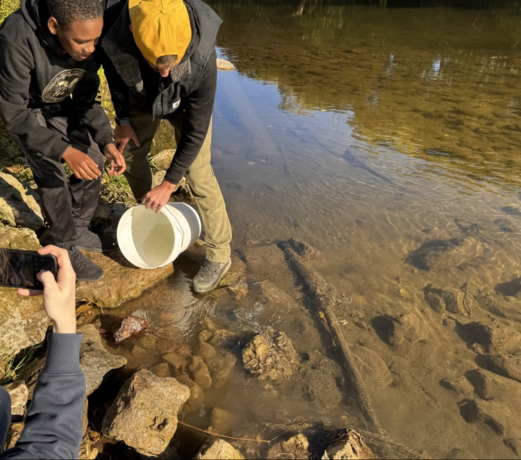 student with trout