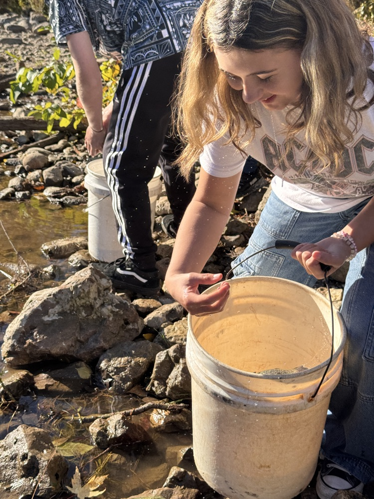 student with trout