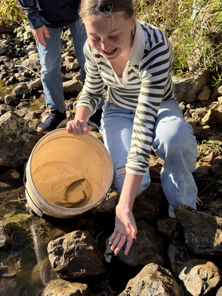 student with trout