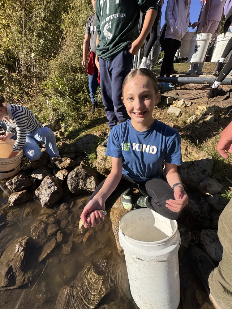 student with trout