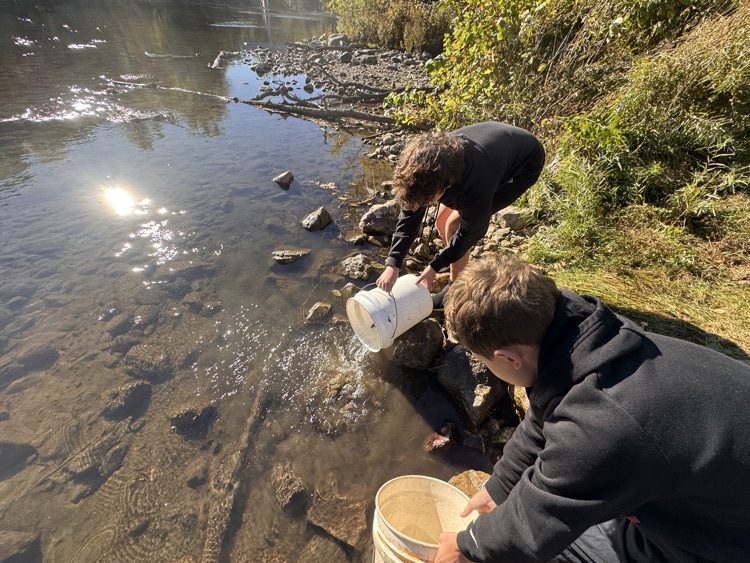 student with trout