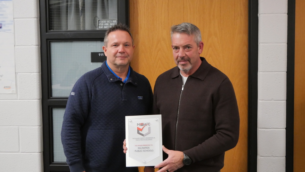 Facilities Director, Brian Akey, accepting the MSAFE award with Set Seg representative.  