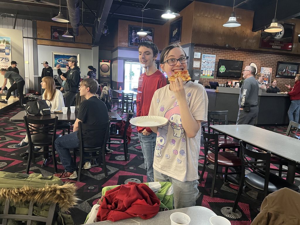 BRVS Students eating pizza at bowling field trip
