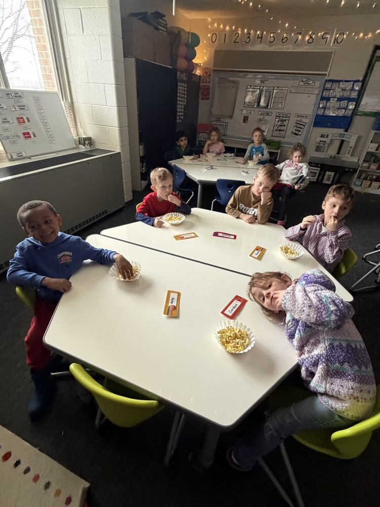 students eating pop orn