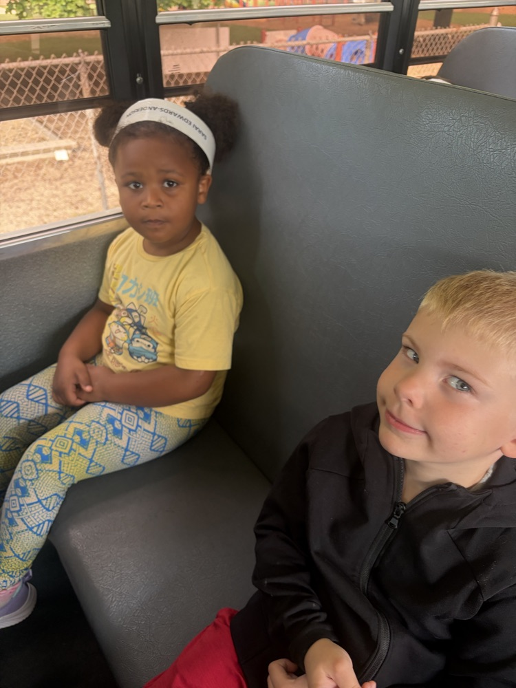 students sitting on the bus 