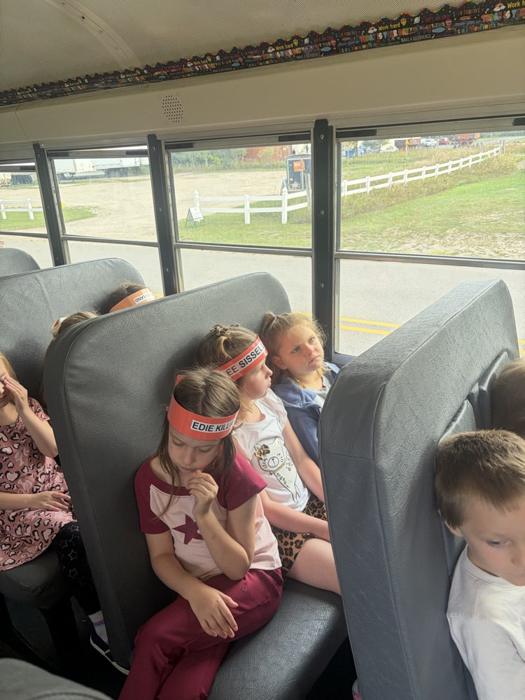 students sitting on the bus 
