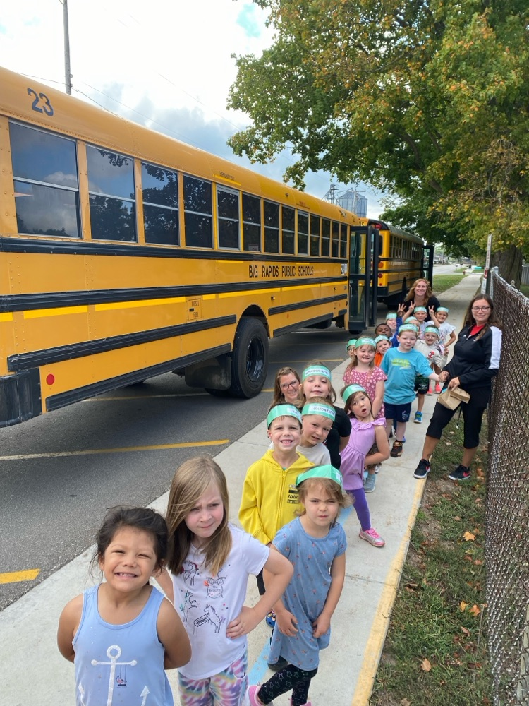 students lined up outside of the bus