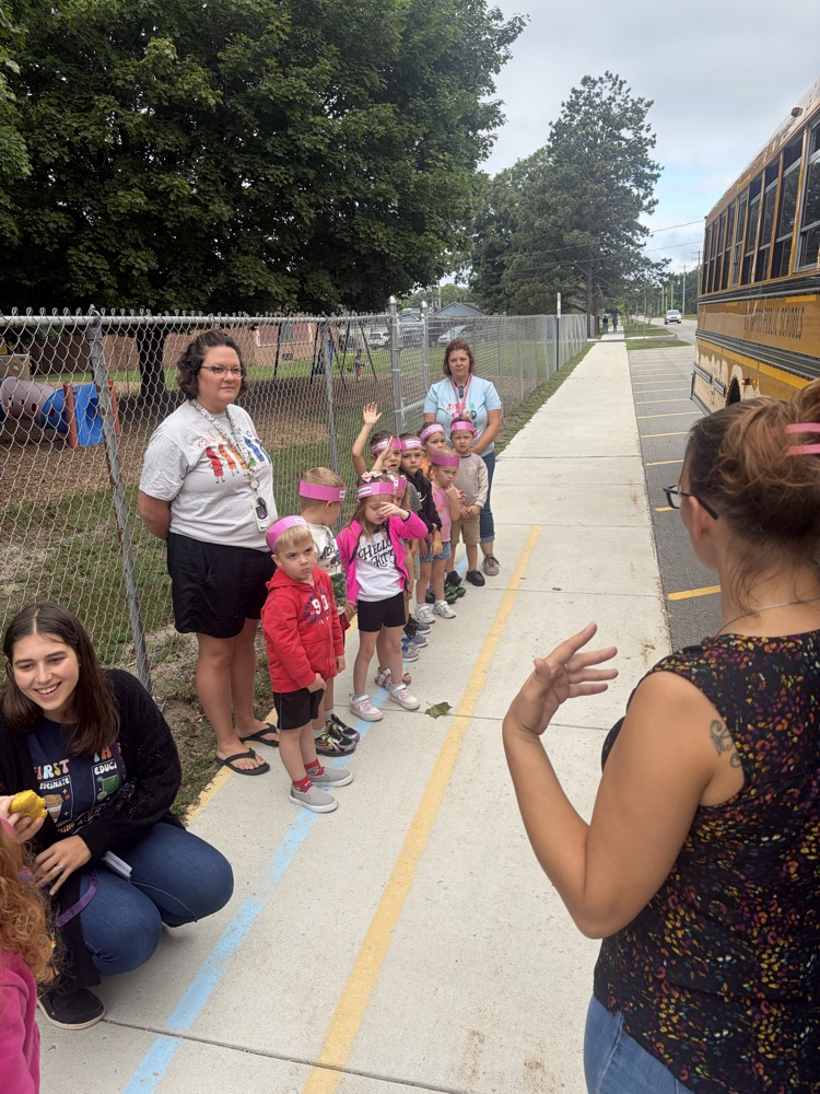 students listening to the bus driver 