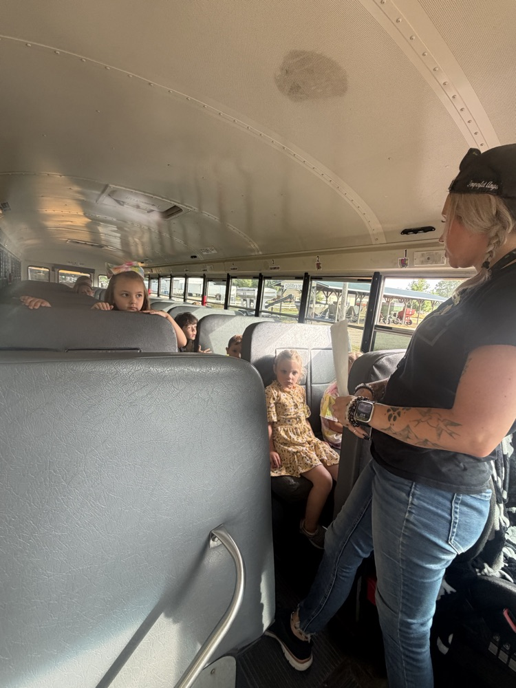 students listening to the bus driver 