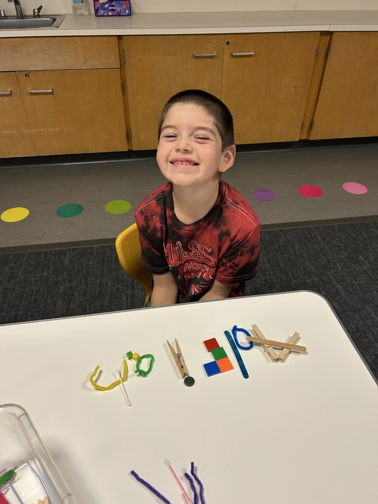 student with art project