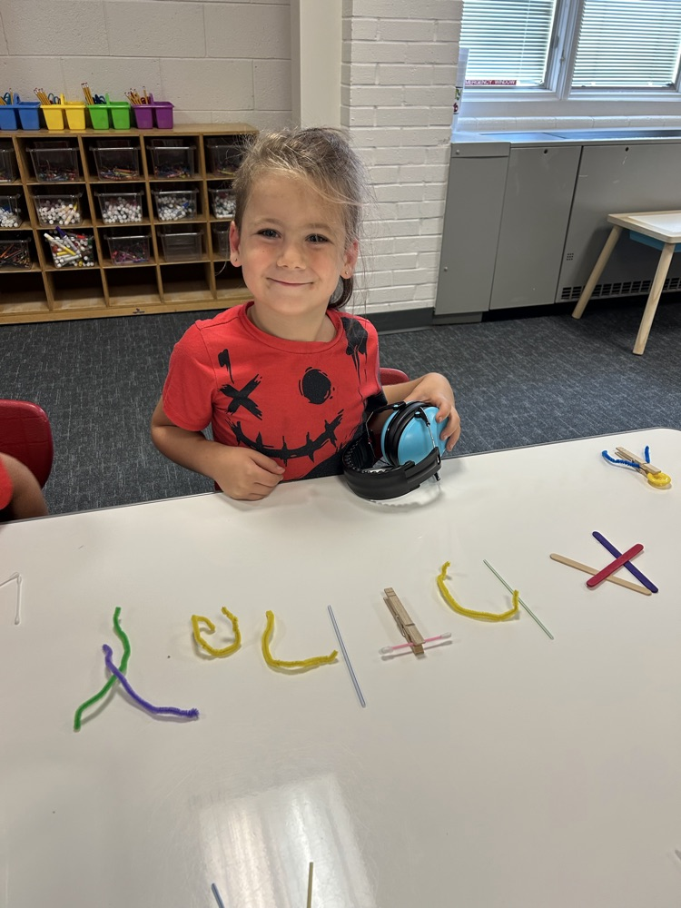 student with art project