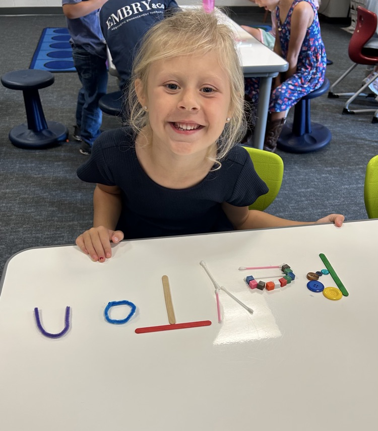 student with art project