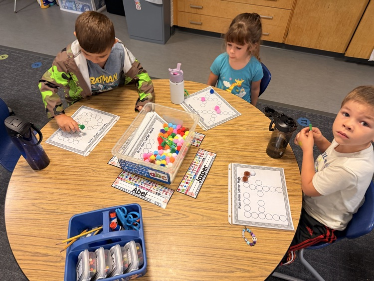 students working with letters
