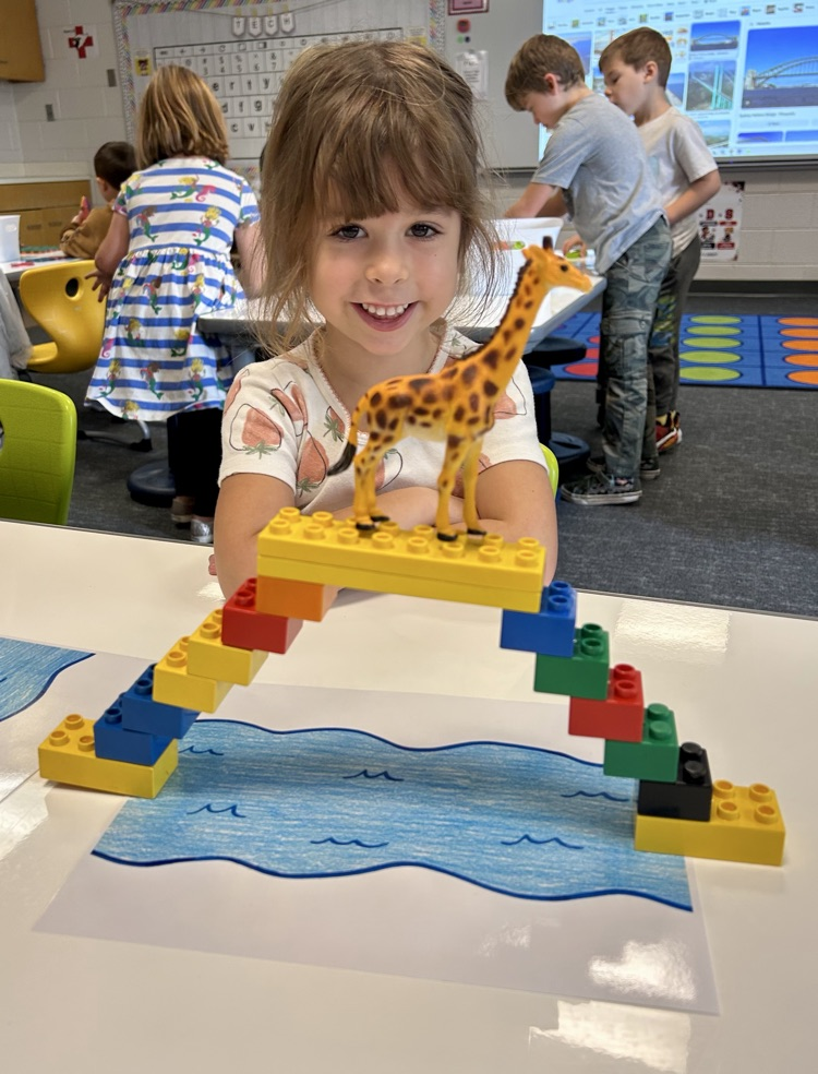 students building a bridge with toys 