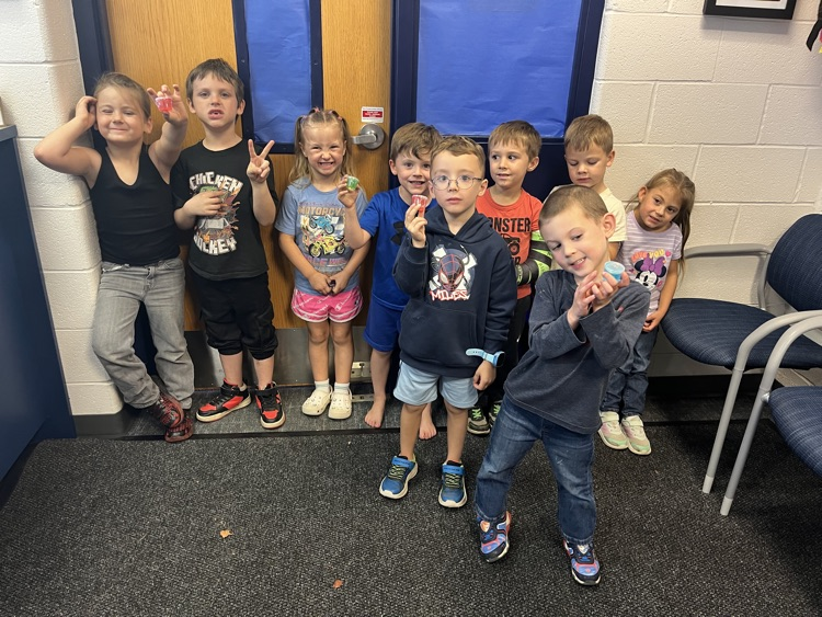 kids in office winning prizes 