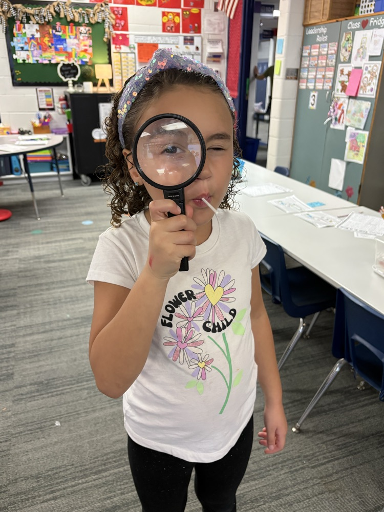 a student with a magnifying glass