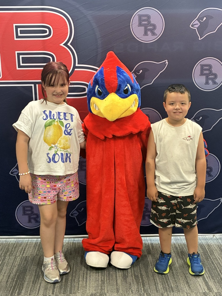 two students with the Cardinal