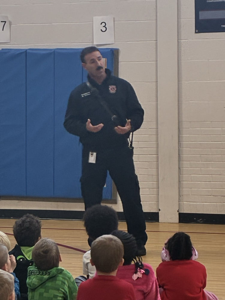 a firefighter talking to Brookside students