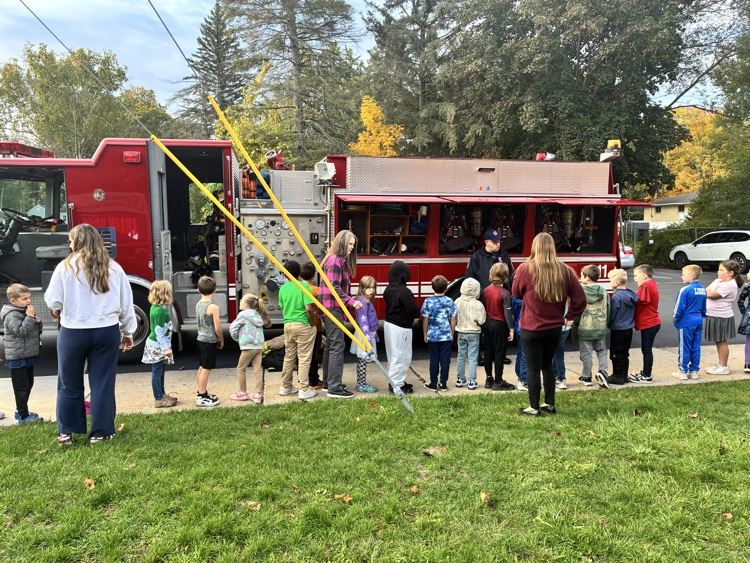 Students exploring the firetruck